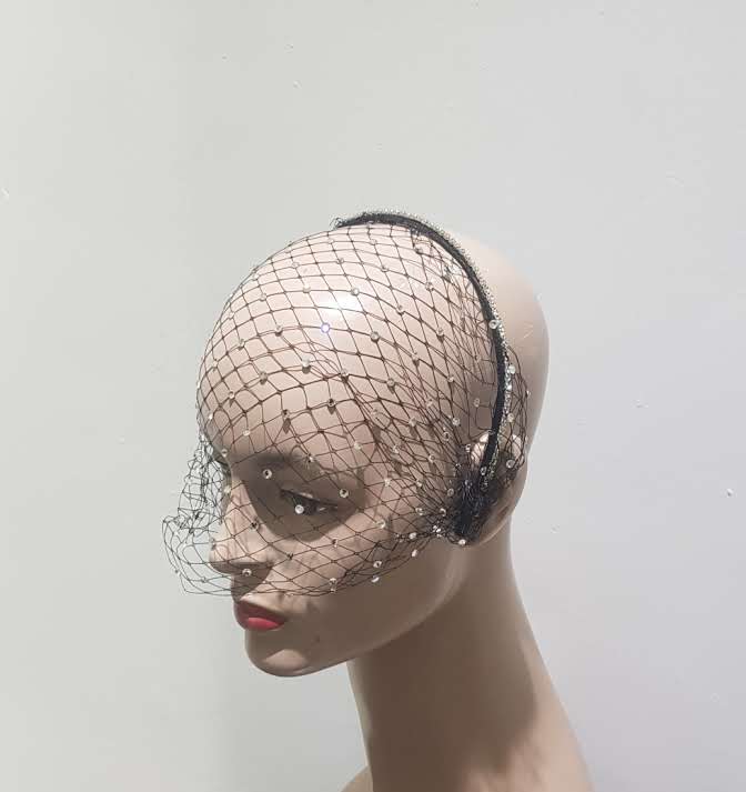 "Elegant headband with Rhinestone veiling."