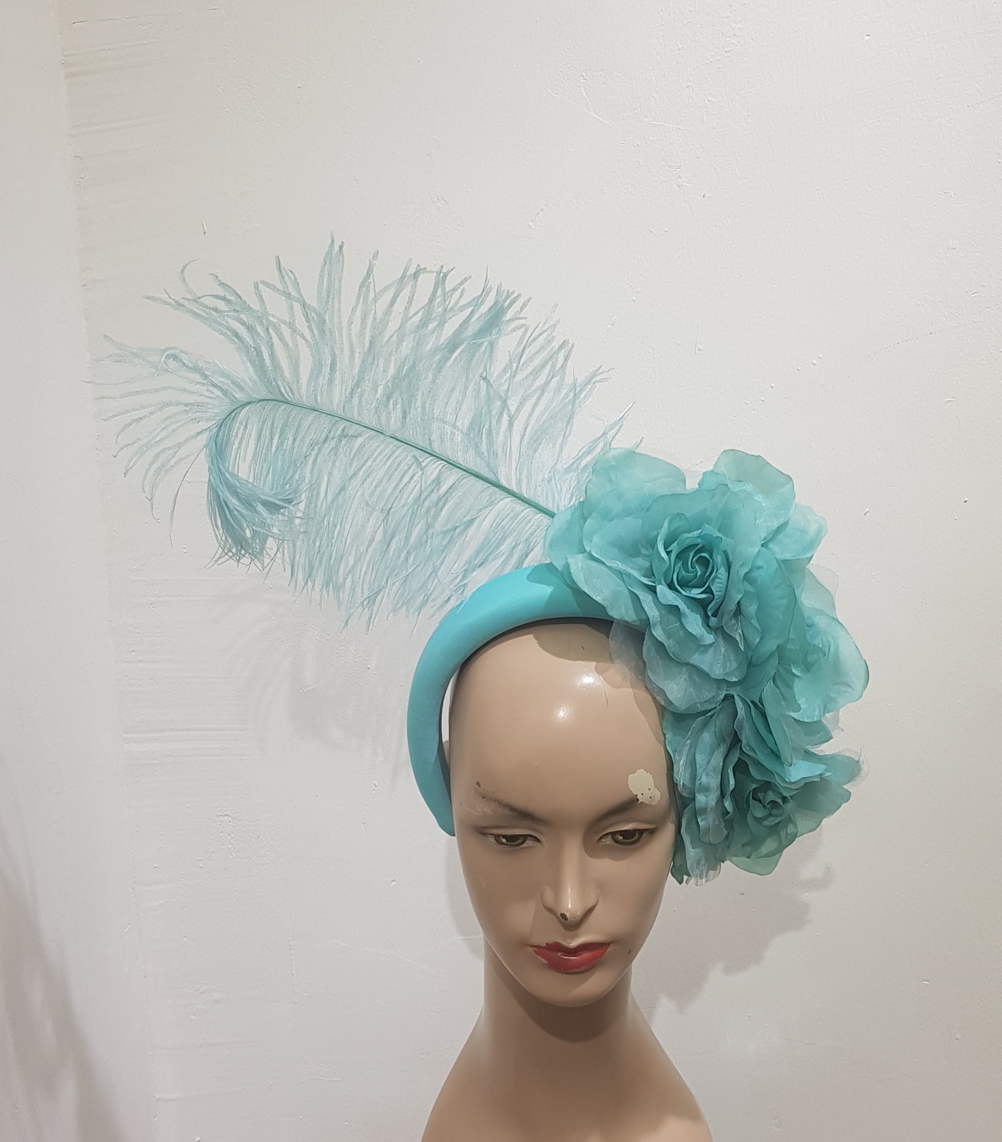 Floral Elegance Fascinator Collection with Vibrant Feather Adornments