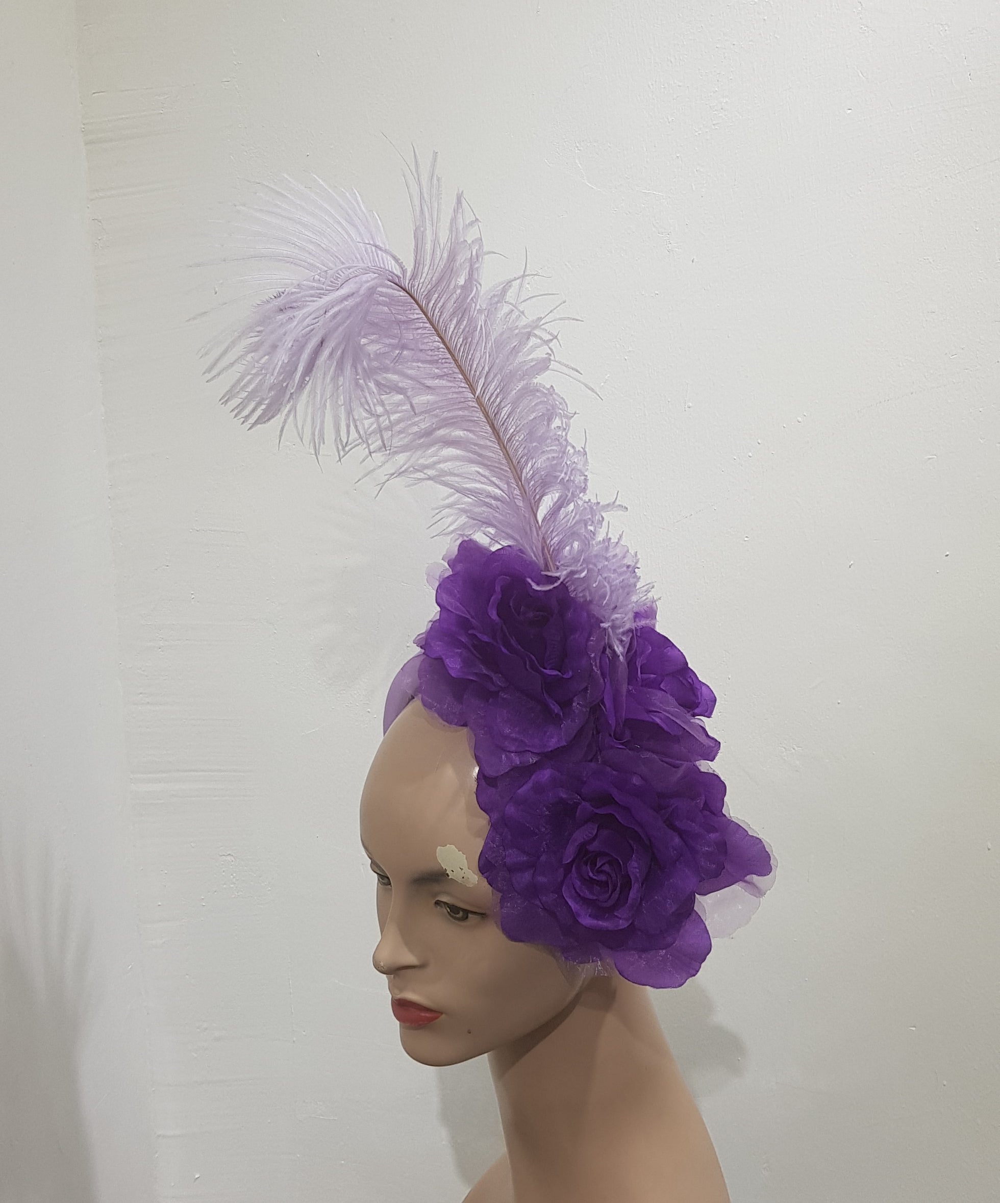 Floral Elegance Fascinator Collection with Vibrant Feather Adornments