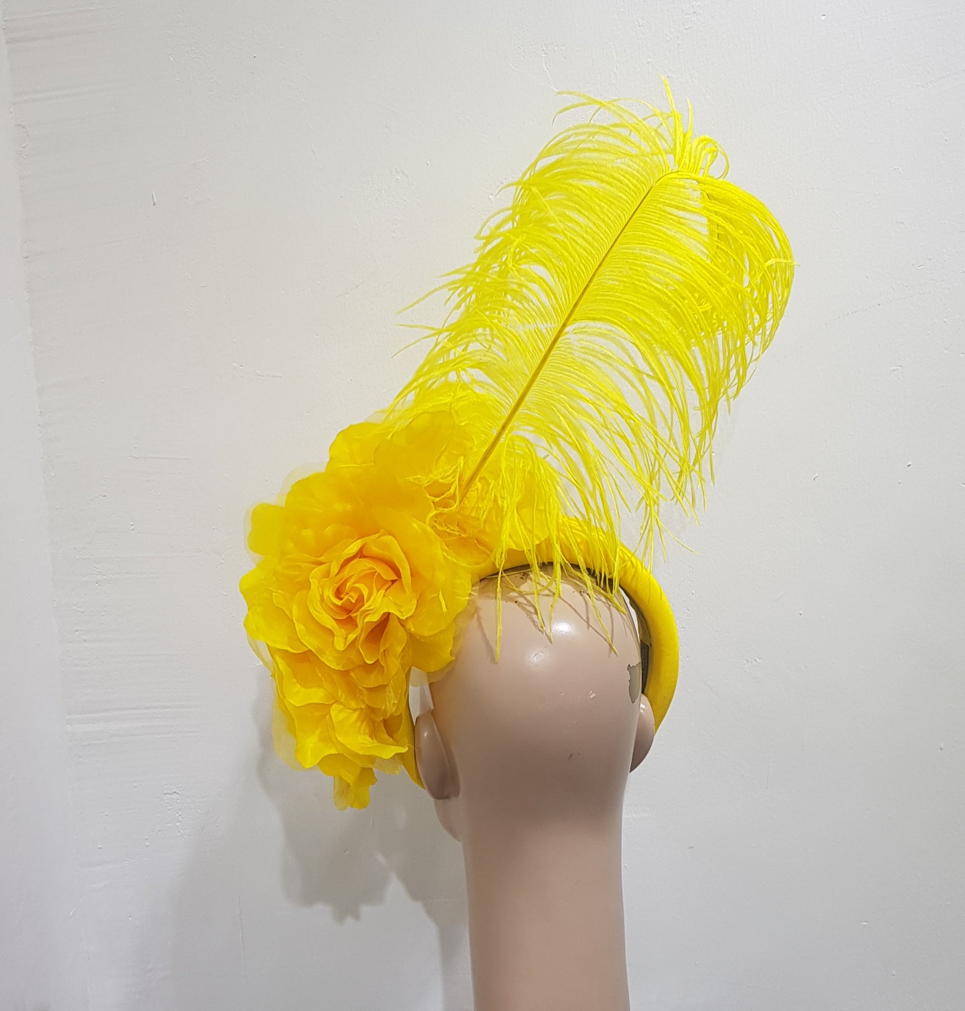 Floral Elegance Fascinator Collection with Vibrant Feather Adornments