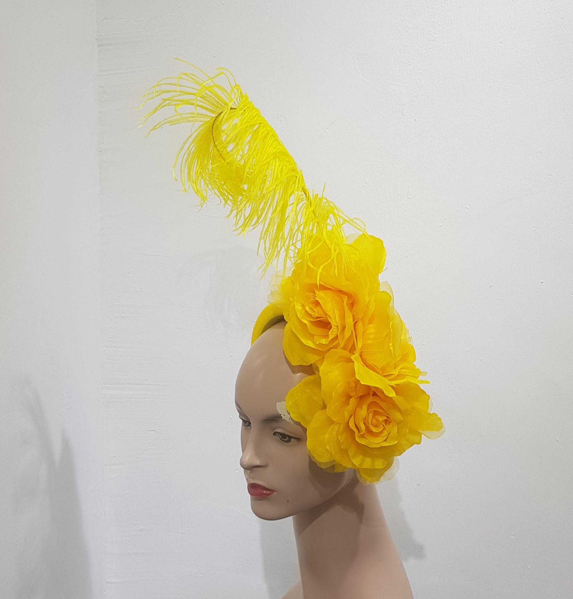 Floral Elegance Fascinator Collection with Vibrant Feather Adornments