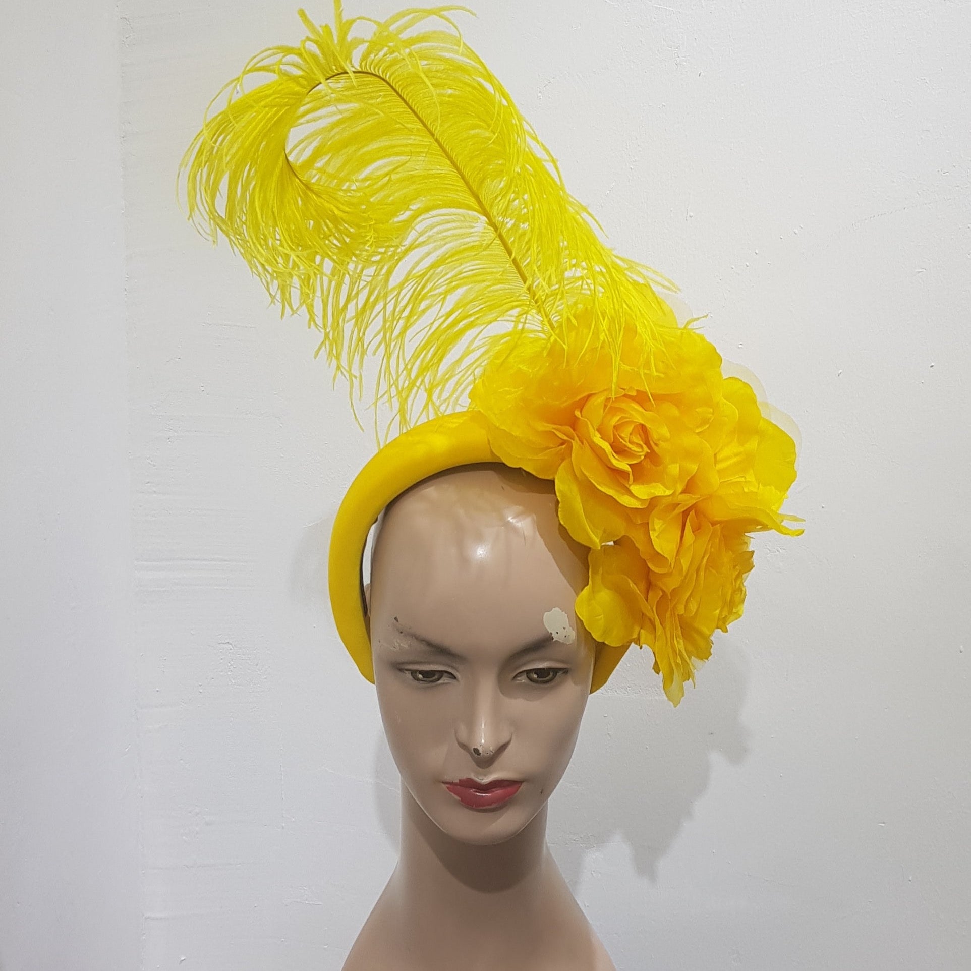 Floral Elegance Fascinator Collection with Vibrant Feather Adornments