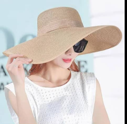 "Elegant, large straw hat with a band and bow for all your summer days"