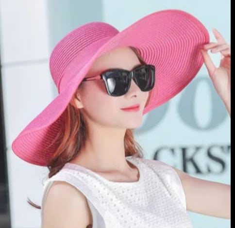 "Elegant, large straw hat with a band and bow for all your summer days"