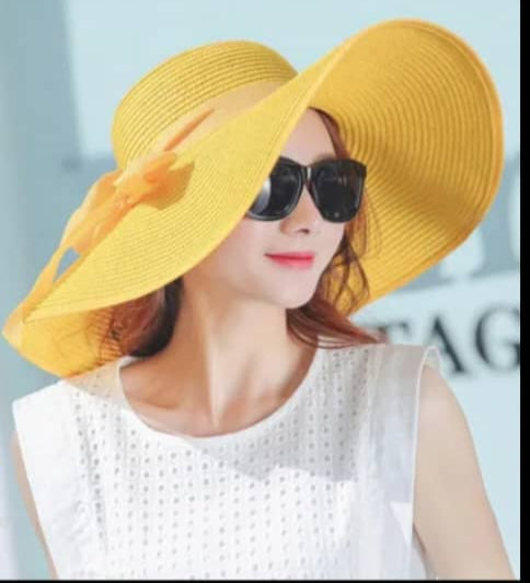 "Elegant, large straw hat with a band and bow for all your summer days"