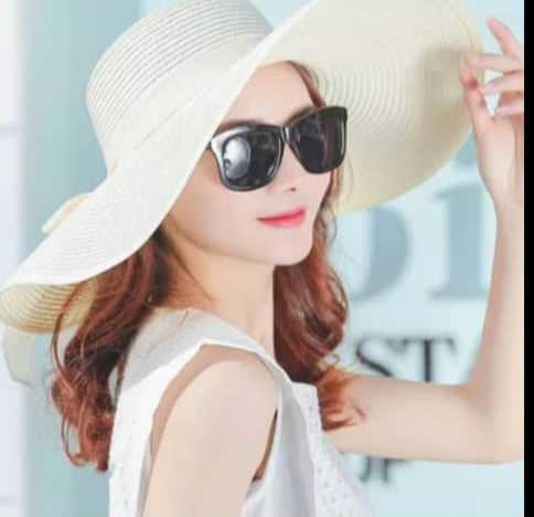 "Elegant, large straw hat with a band and bow for all your summer days"