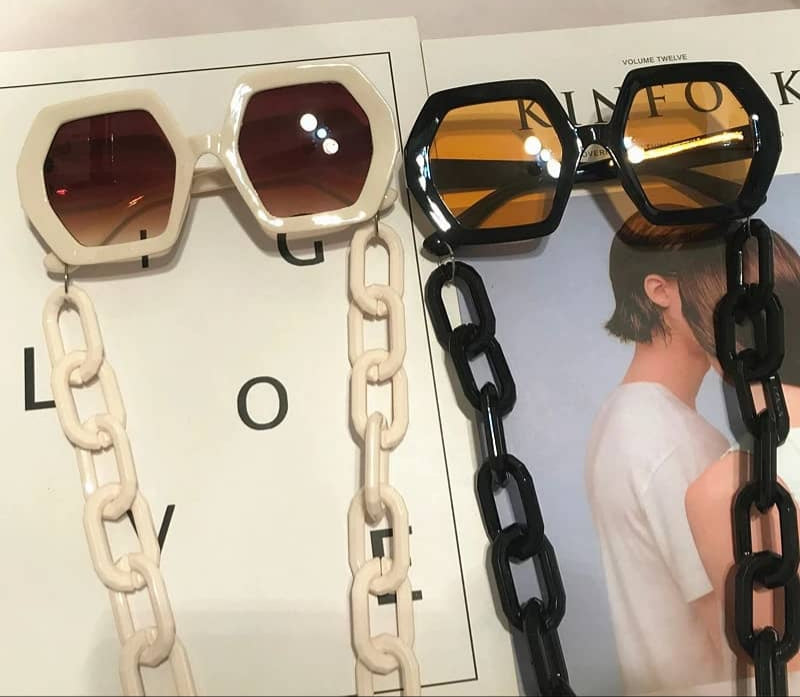 Unique sunglasses with a long trendy chain in the same color