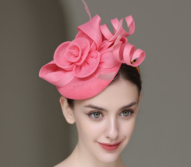 "Elegant sinamay-like feathered fascinator"