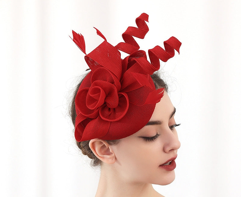 "Elegant sinamay-like feathered fascinator"