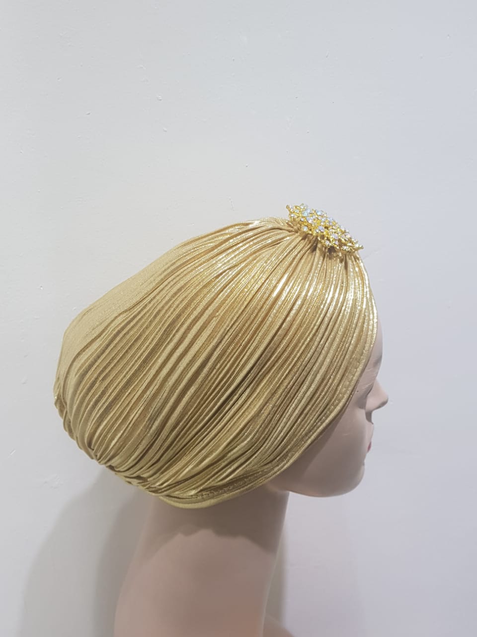 "Sapphire and Gold Pleated Turbans with Crystal Embellishments"