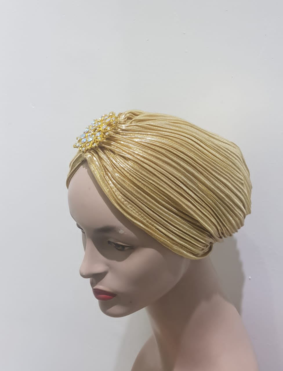 "Sapphire and Gold Pleated Turbans with Crystal Embellishments"