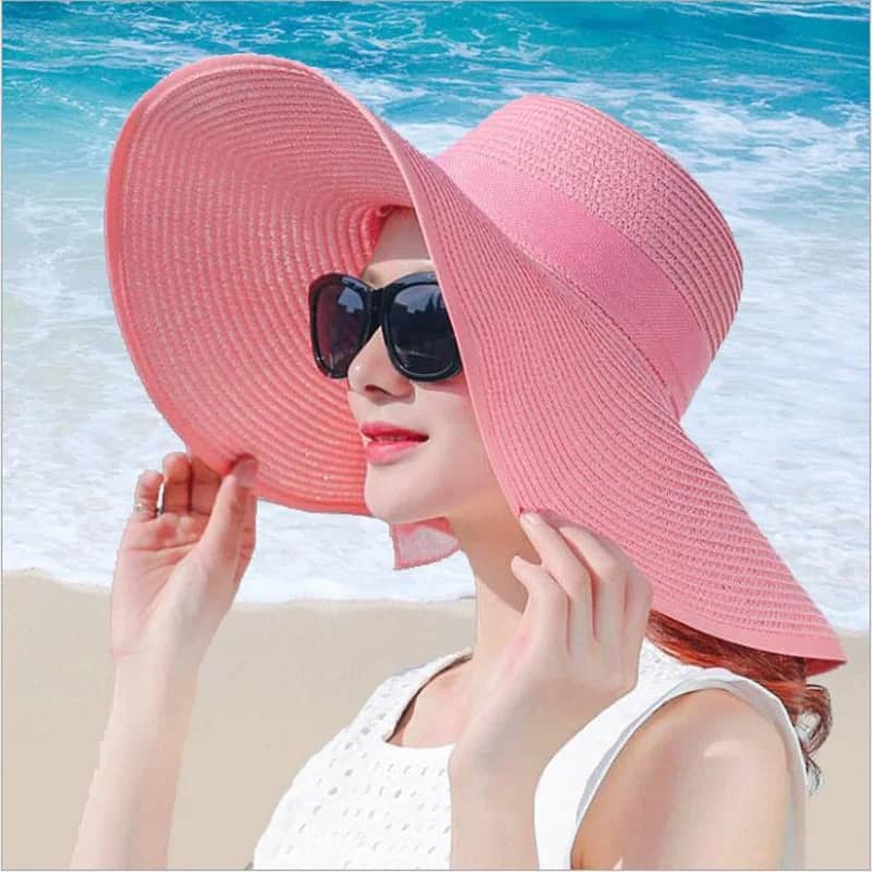 "Elegant, large straw hat with a band and bow for all your summer days"