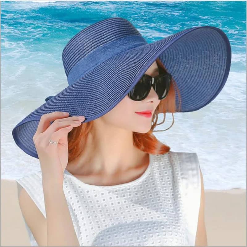 "Elegant, large straw hat with a band and bow for all your summer days"