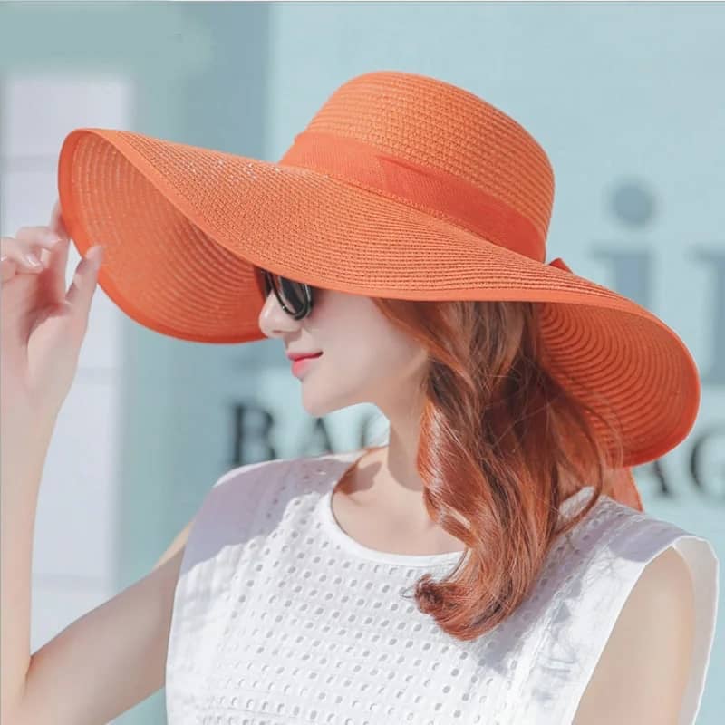 "Elegant, large straw hat with a band and bow for all your summer days"