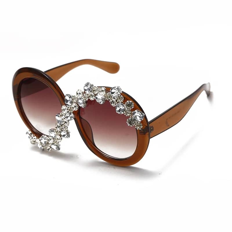 Fashion forward oversized round sunglasses with diamond-like stones