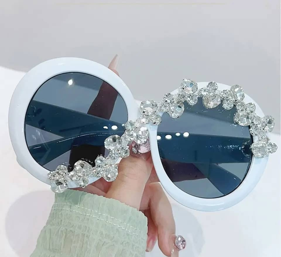 Fashion forward oversized round sunglasses with diamond-like stones