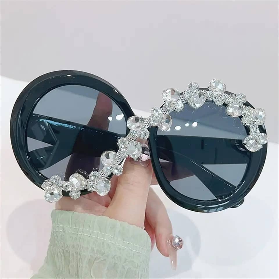 Fashion forward oversized round sunglasses with diamond-like stones