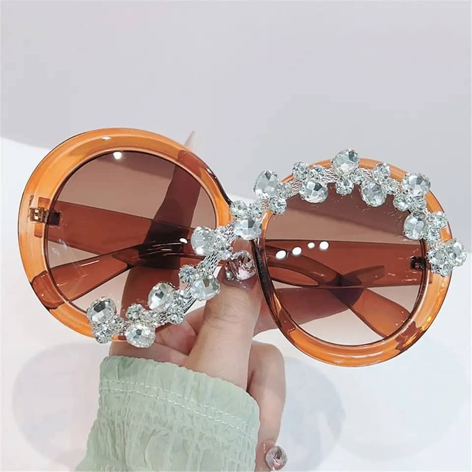 Fashion forward oversized round sunglasses with diamond-like stones