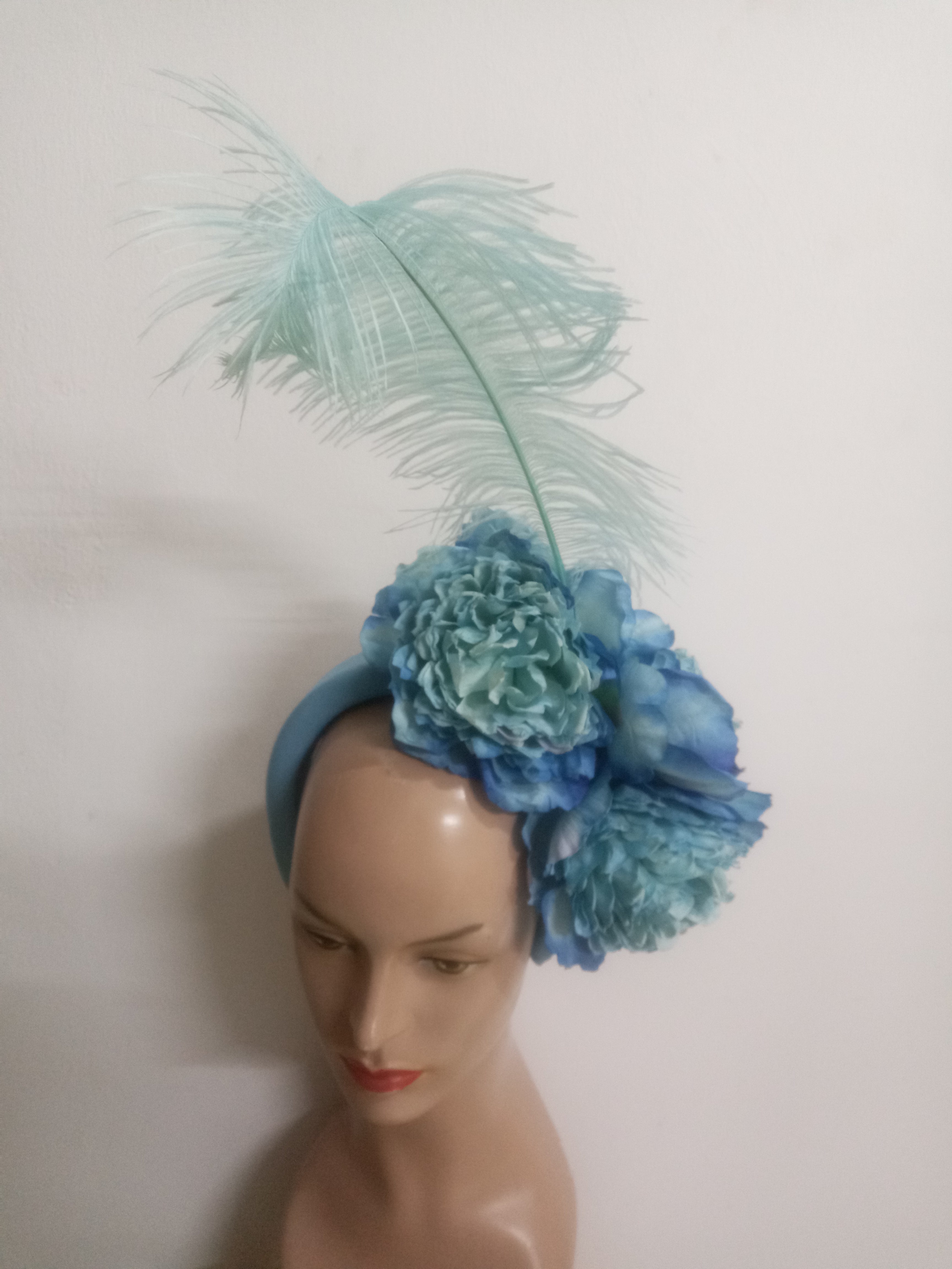 Floral Elegance Fascinator Collection with Vibrant Feather Adornments