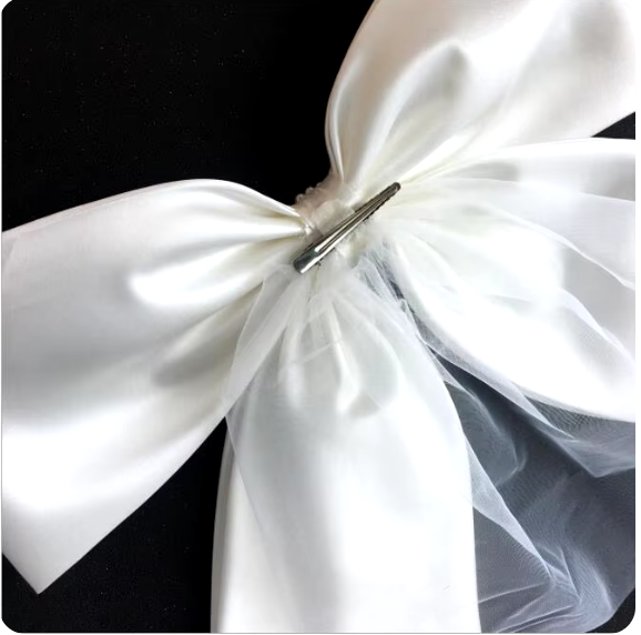 "Ivory Elegance: The Bow Veil Fascinator"