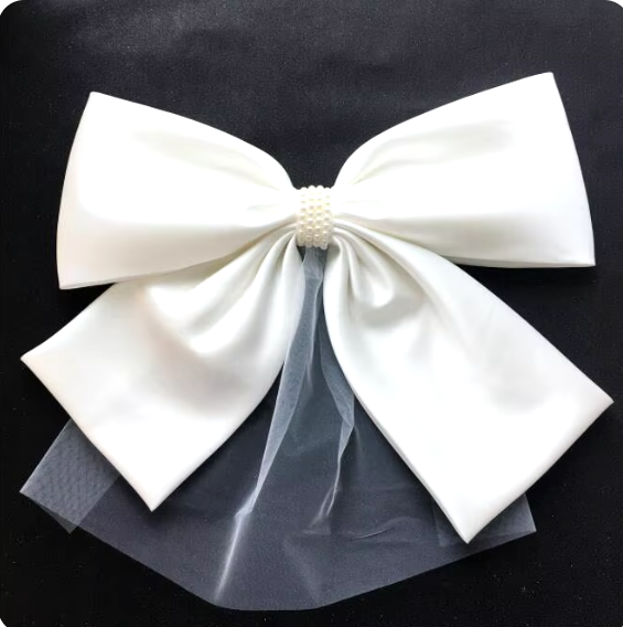 "Ivory Elegance: The Bow Veil Fascinator"